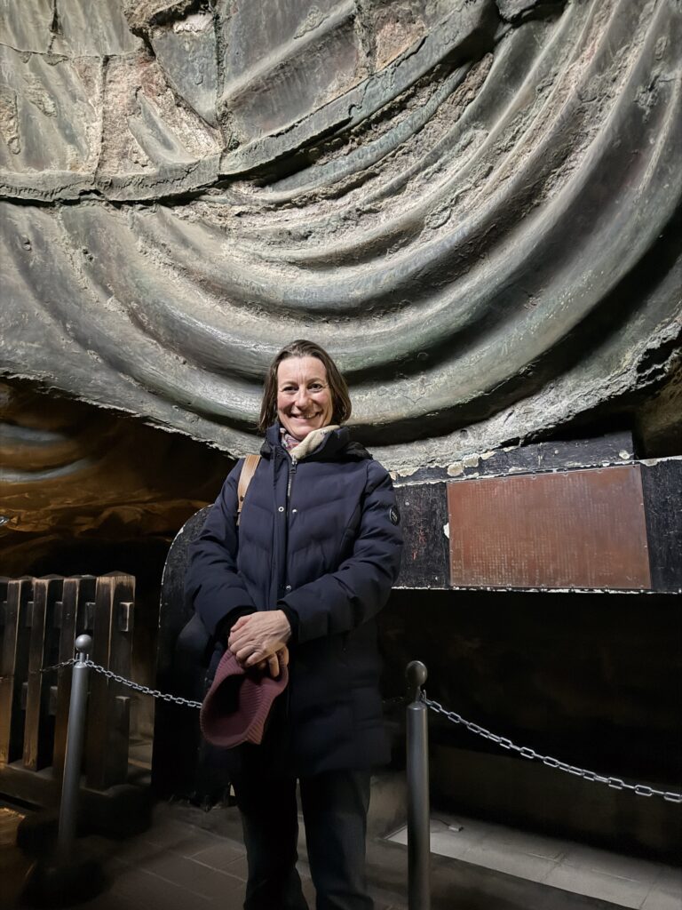 Guest taking a photo inside the Great Buddha at Kotoku-in Temple in Kamakura