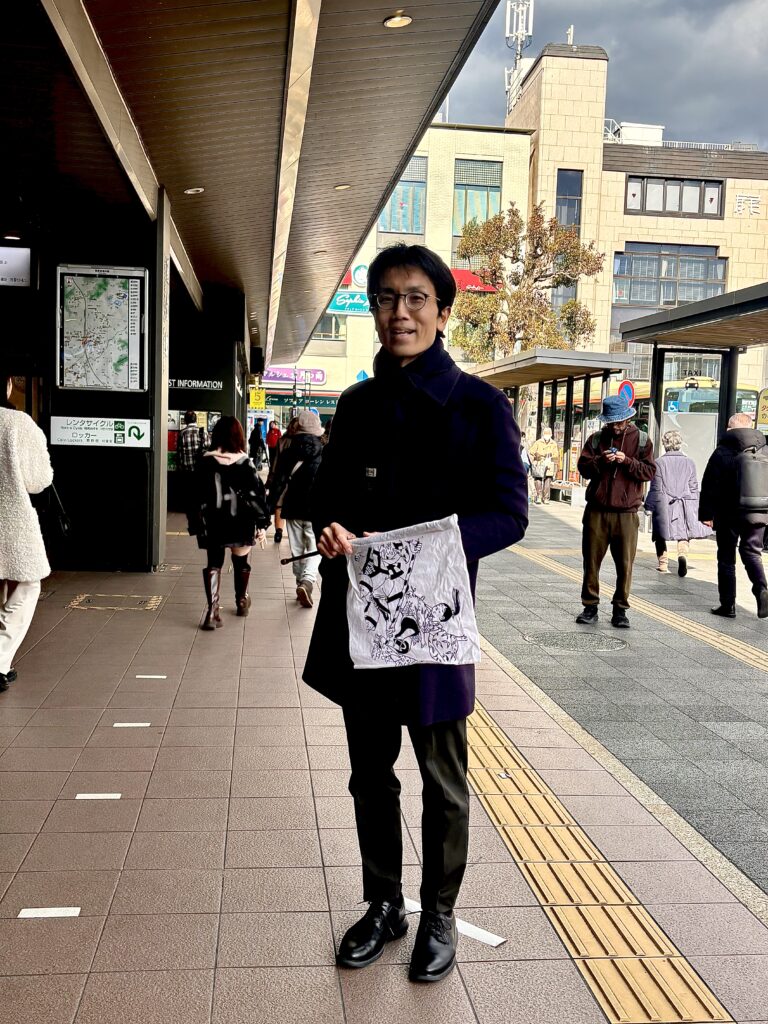 Local guide Takumi Ikeda waiting for guests at Kamakura Station meeting point